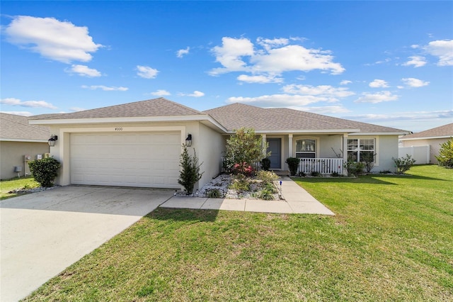 ranch-style house featuring a porch, an attached garage, stucco siding, a front lawn, and concrete driveway