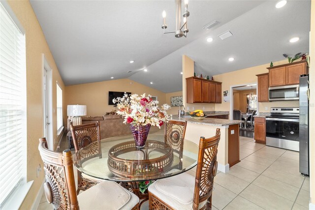 4000 SE 98th Pl, Belleview, FL 34420 - dining area with visible vents, a chandelier, vaulted ceiling, light tile patterned floors, and recessed lighting