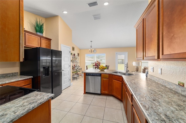 4000 SE 98th Pl, Belleview, FL 34420 - kitchen featuring brown cabinetry, visible vents, appliances with stainless steel finishes, and a sink