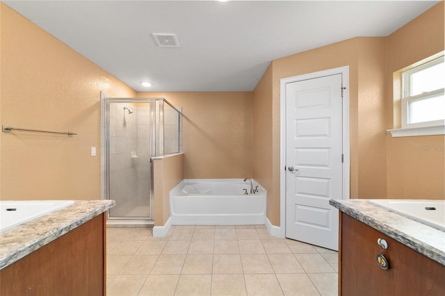 4000 SE 98th Pl, Belleview, FL 34420 - bathroom with a bath, visible vents, a stall shower, and vanity