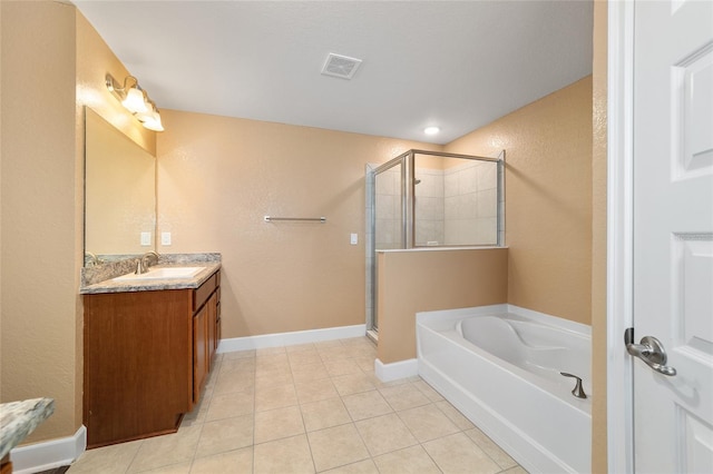4000 SE 98th Pl, Belleview, FL 34420 - bathroom with tile patterned floors, visible vents, a shower stall, a bath, and vanity