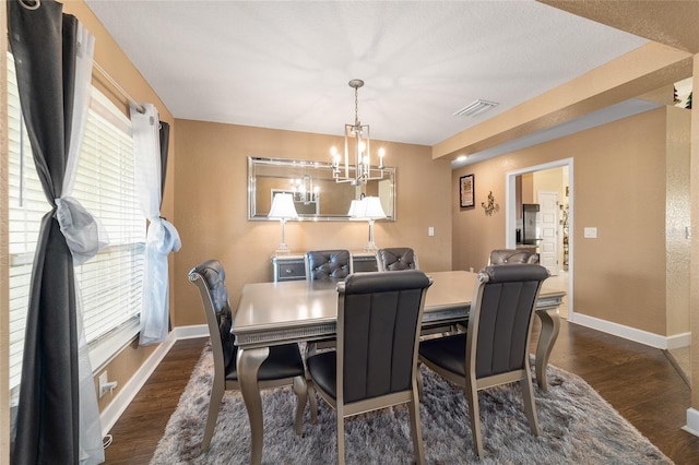 4000 SE 98th Pl, Belleview, FL 34420 - dining area featuring visible vents, baseboards, dark wood-type flooring, and a chandelier