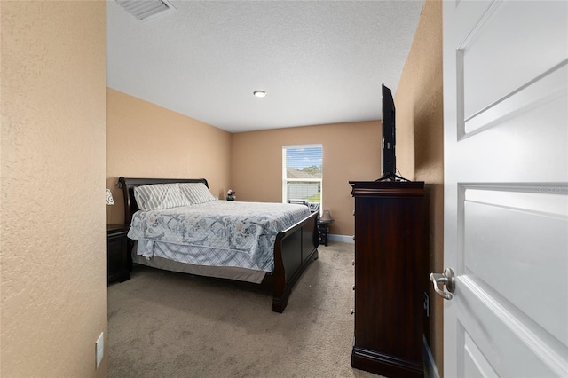 4000 SE 98th Pl, Belleview, FL 34420 - carpeted bedroom featuring visible vents, baseboards, and a textured wall