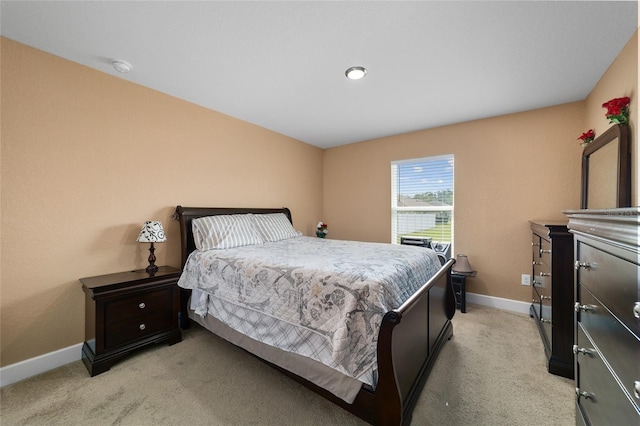 4000 SE 98th Pl, Belleview, FL 34420 - bedroom featuring light colored carpet and baseboards