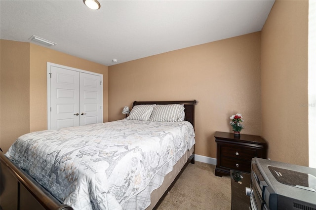 4000 SE 98th Pl, Belleview, FL 34420 - bedroom with a closet, visible vents, light colored carpet, and baseboards