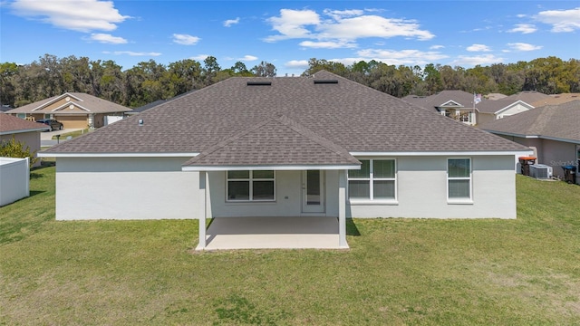 4000 SE 98th Pl, Belleview, FL 34420 - back of property featuring a yard, stucco siding, a shingled roof, and a patio