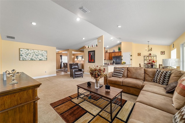 4000 SE 98th Pl, Belleview, FL 34420 - living room with visible vents, light colored carpet, baseboards, and vaulted ceiling