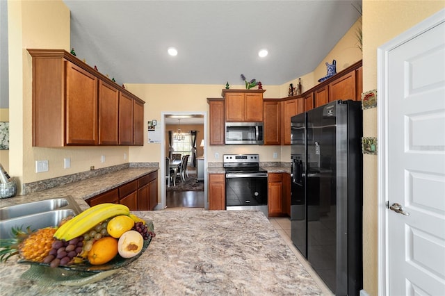 4000 SE 98th Pl, Belleview, FL 34420 - kitchen with light stone counters, recessed lighting, a sink, stainless steel appliances, and brown cabinets