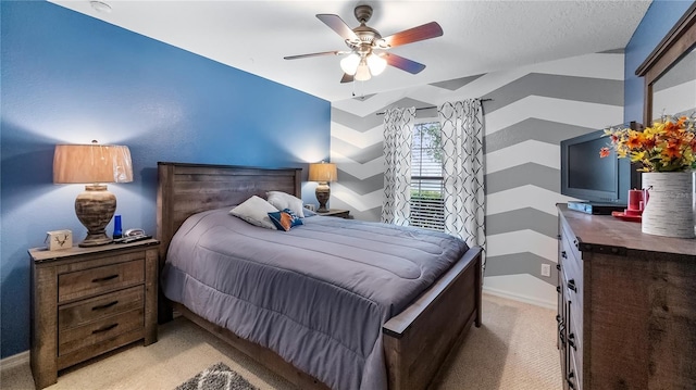 bedroom featuring light carpet, ceiling fan, and baseboards