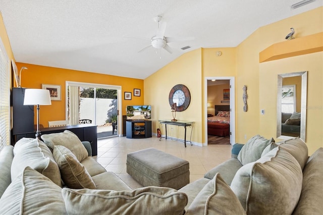 living room featuring light tile patterned floors, visible vents, and a wealth of natural light