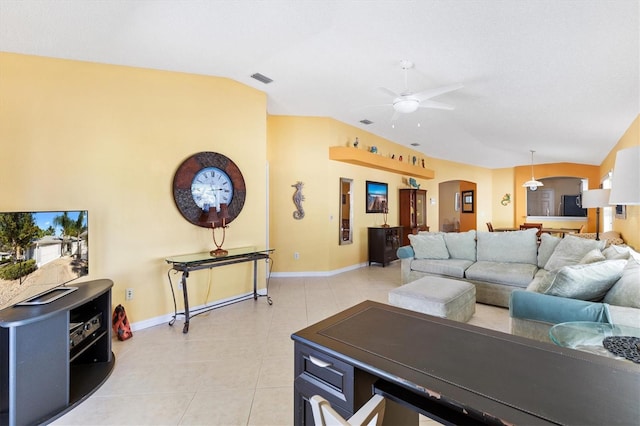 living area featuring light tile patterned floors, visible vents, arched walkways, lofted ceiling, and ceiling fan