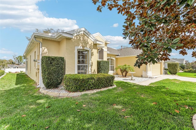 5135 Aurora Dr, Leesburg, FL 34748 - view of front facade featuring a garage, a front yard, concrete driveway, and stucco siding