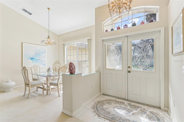 5135 Aurora Dr, Leesburg, FL 34748 - entrance foyer with light carpet, visible vents, a wealth of natural light, and french doors