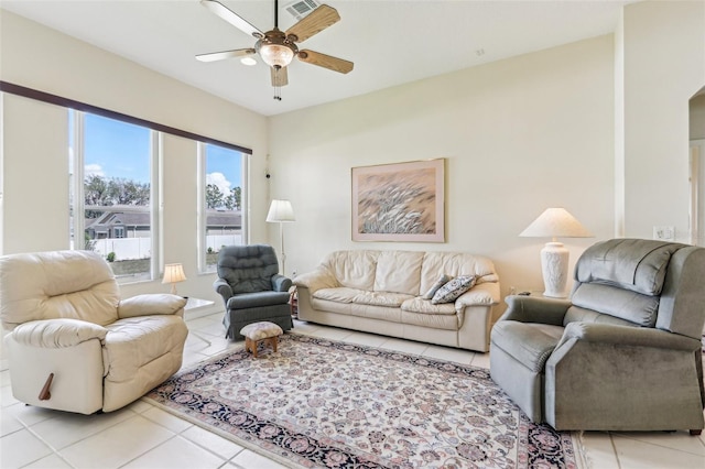 5135 Aurora Dr, Leesburg, FL 34748 - living area with light tile patterned floors, visible vents, and a ceiling fan