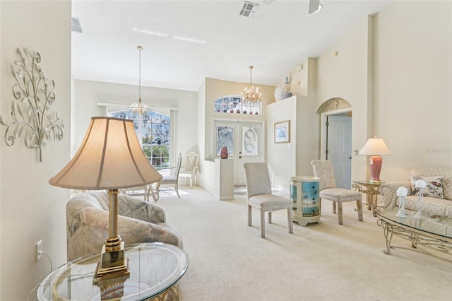 5135 Aurora Dr, Leesburg, FL 34748 - sitting room featuring a chandelier, carpet, french doors, and visible vents