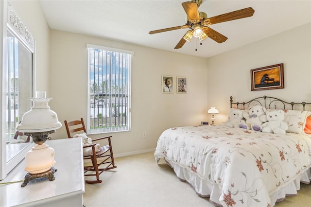 5135 Aurora Dr, Leesburg, FL 34748 - bedroom featuring light carpet, a ceiling fan, and baseboards