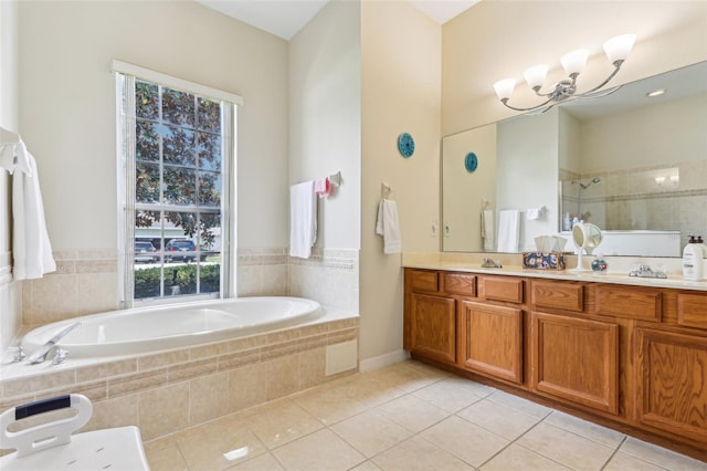 5135 Aurora Dr, Leesburg, FL 34748 - full bath featuring double vanity, tiled shower, tile patterned flooring, and a garden tub