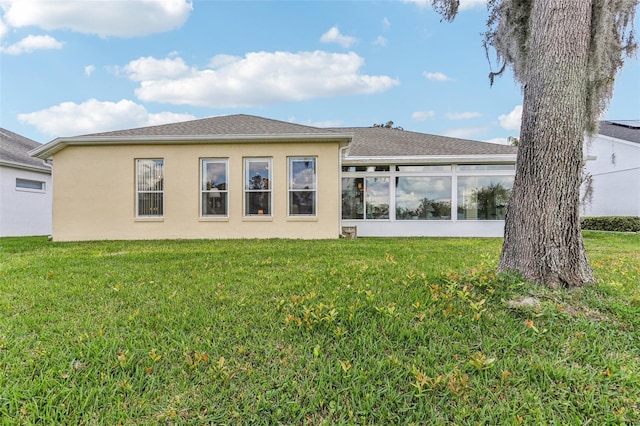5135 Aurora Dr, Leesburg, FL 34748 - rear view of property featuring a lawn and stucco siding
