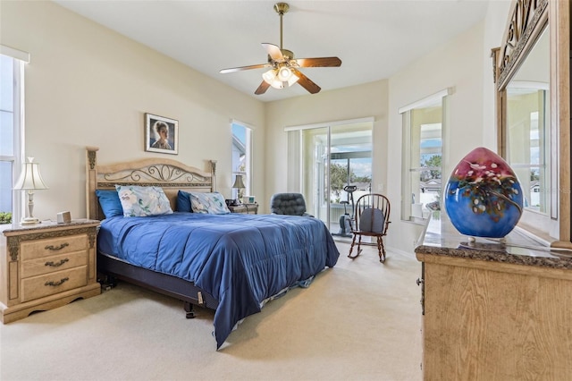 5135 Aurora Dr, Leesburg, FL 34748 - bedroom with light carpet, baseboards, a ceiling fan, and access to exterior