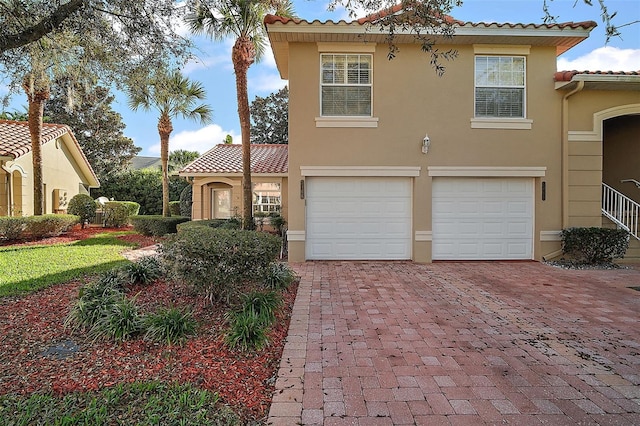 mediterranean / spanish-style home featuring a garage