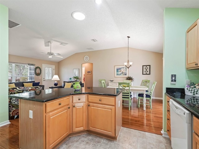 kitchen featuring open floor plan, vaulted ceiling, white dishwasher, and a center island