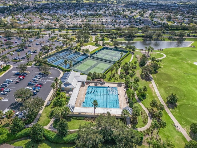 aerial view featuring a water view and golf course view