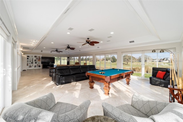 game room with a raised ceiling, pool table, crown molding, and light tile patterned floors