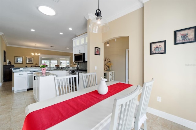 dining area with recessed lighting, arched walkways, a chandelier, and ornamental molding