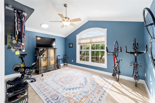 exercise room with ceiling fan, vaulted ceiling, ornamental molding, and baseboards