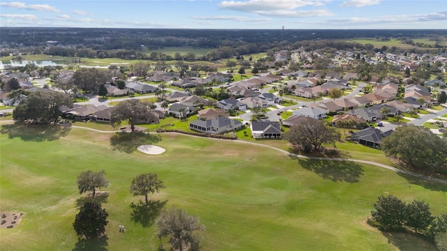 bird's eye view featuring view of golf course, a water view, and a residential view
