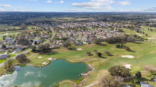 bird's eye view with a residential view, golf course view, and a water view