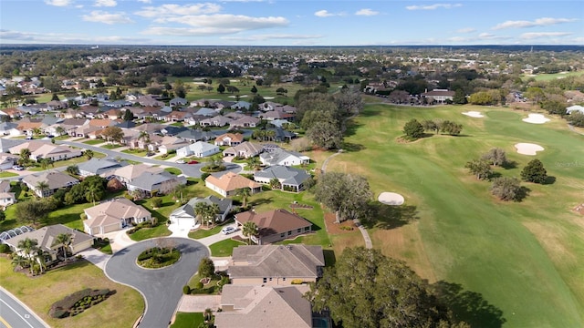 drone / aerial view with a residential view and view of golf course