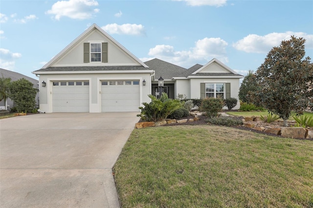 view of front of property featuring concrete driveway, roof with shingles, a front lawn, and stucco siding