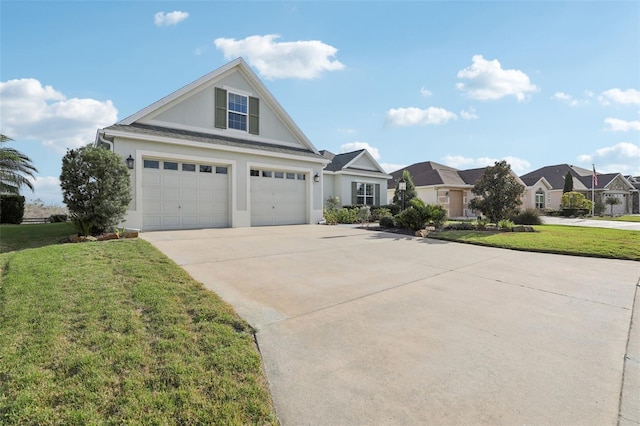 view of front of home with stucco siding, concrete driveway, an attached garage, a front yard, and a residential view