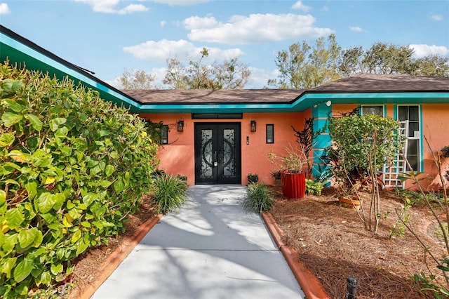 entrance to property featuring french doors