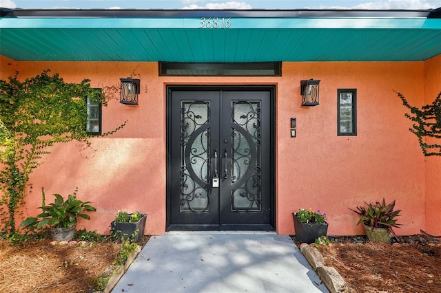 property entrance featuring french doors