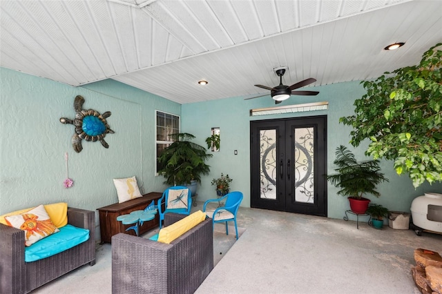 interior space with french doors and ceiling fan