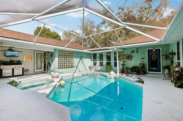 view of pool featuring an in ground hot tub, a patio, and a lanai