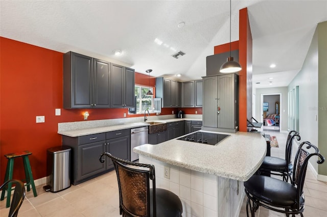 kitchen with stainless steel dishwasher, gray cabinetry, and pendant lighting