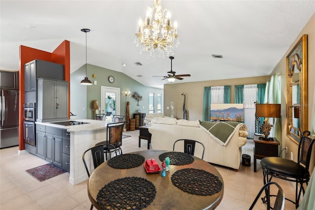 dining room with ceiling fan, light tile patterned flooring, and lofted ceiling