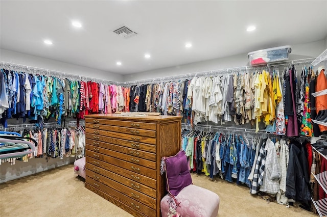 walk in closet featuring carpet