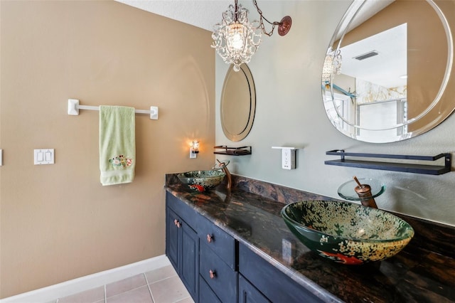 bathroom with vanity and tile patterned floors