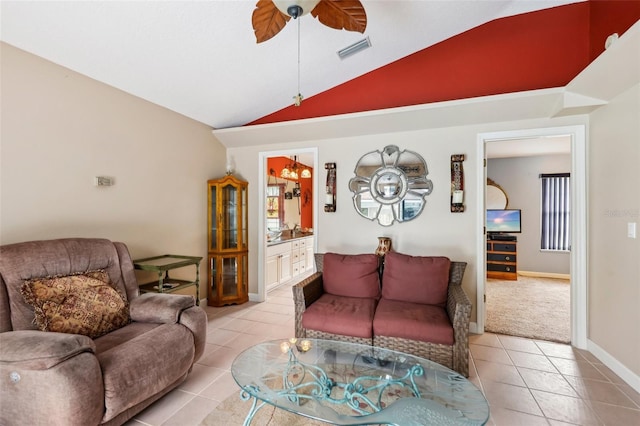 tiled living room featuring vaulted ceiling and ceiling fan