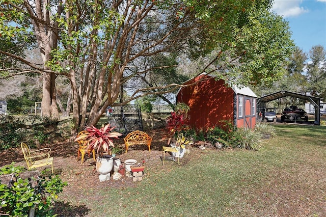 view of yard featuring a carport and a storage shed