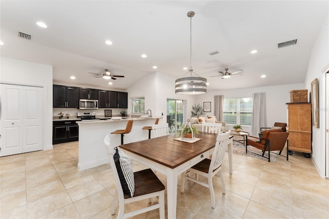 dining room featuring lofted ceiling, light tile patterned flooring, visible vents, and recessed lighting