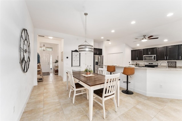 dining room with ceiling fan, stairway, baseboards, and recessed lighting