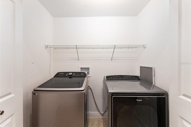 clothes washing area with laundry area and separate washer and dryer