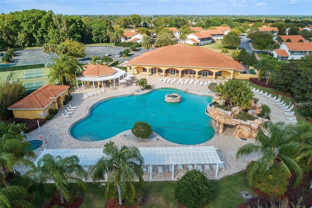 pool with a patio and a pergola