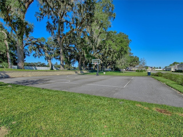 view of sport court with a yard and community basketball court