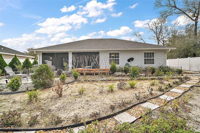 view of front of house featuring a sunroom